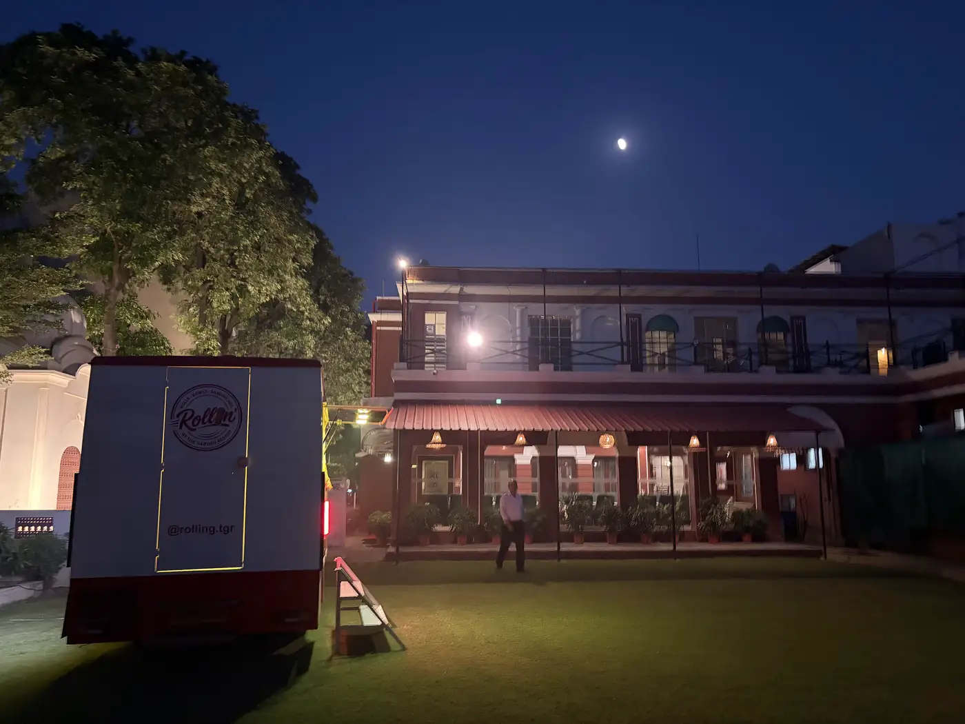 The Rollin' truck on the lawn at The Garden Resort at dusk